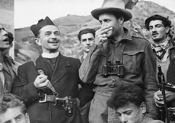 Italian partisans with Luigi Piazza, a priest of San Valentino. Circa October 1944