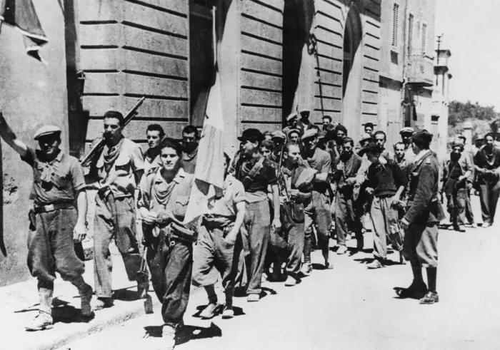 Framed Print : Italian partisans march down the streets of Pomerance after troops of the 5th Army took