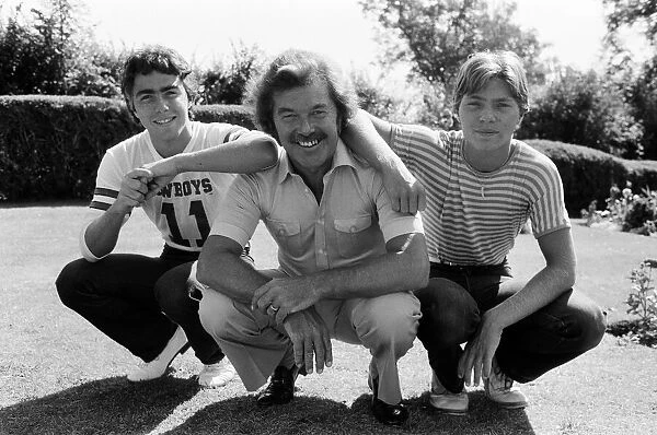 ITVs Dickie Davies with his two sons, Pete (fair hair) and Dan