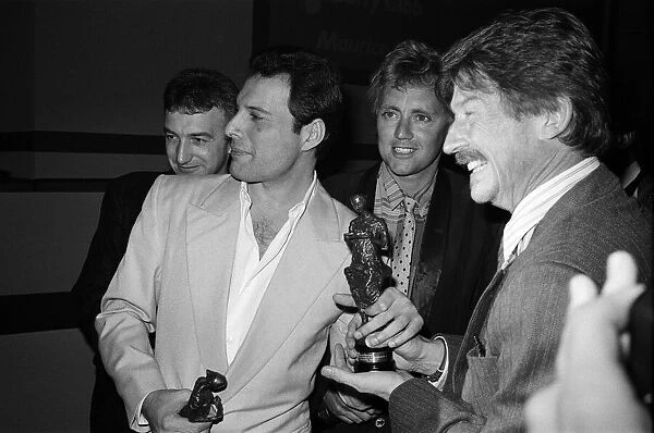 The Ivor Novello Awards. Pictured, John Deacon, Freddie Mercury