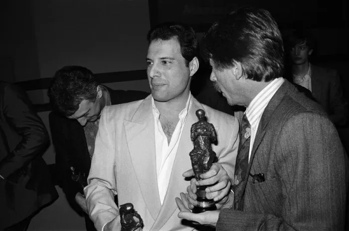Framed Print : The Ivor Novello Awards. Pictured, John Deacon and Freddie Mercury of Queen with their