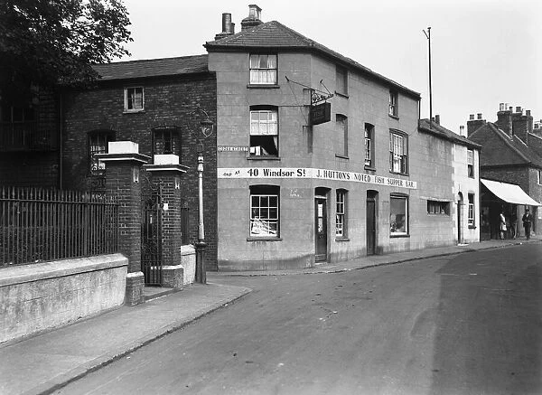 J Huttons noted Fish Supper Bar at Vine Street junction with Cross Street, Uxbridge