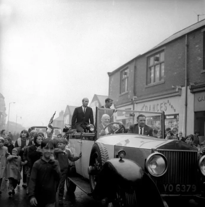 Framed Print : Jack and Bobby Charlton look over-awed as youngsters crowd around the car taking them to Framed Print : Jack and Bobby Charlton look over-awed as youngsters crowd around the car taking them to
