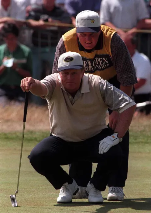 Framed Print : Jack Nicklaus Golfer measures up the line of play with his son Steve on the 18th green