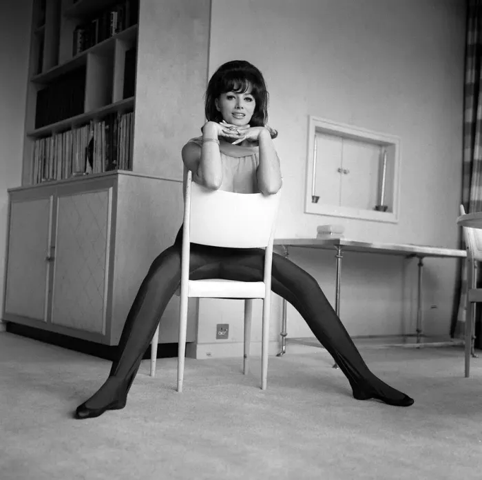 Framed Print : Jackie Collins authoress sitting astride a chair at home Mar 1964 Framed Print : Jackie Collins authoress sitting astride a chair at home Mar 1964