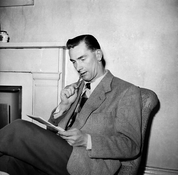 Jackie Milburn, at the Buxton Palace hotel, in pensive mood, writing to his wife Laura