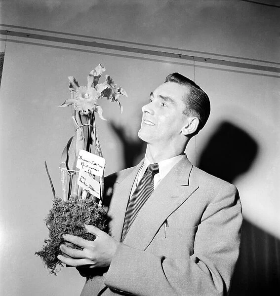 Jackie Milburn (Newcastle United footballer), with the orchid which he had named after