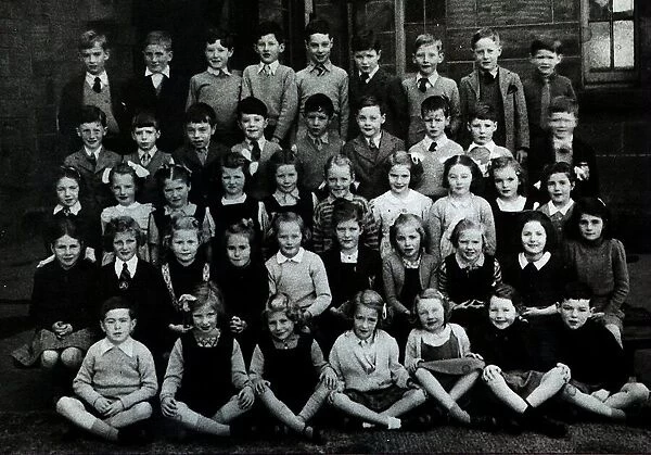 Jackie Stewart pictured as young boy in a school group photograph in Dumbarton
