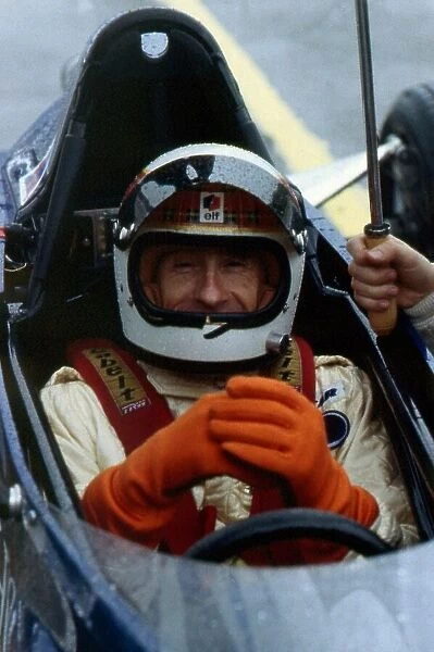 Jackie Stewart sitting in his sons racing car June 1987