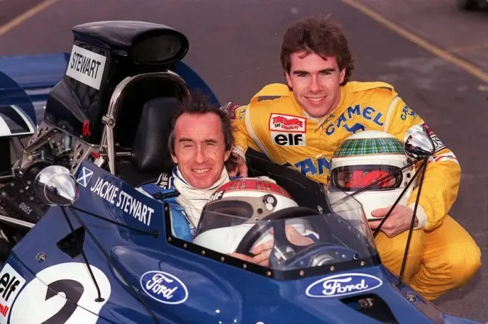 Framed Print : Jackie Stewart with son Paul - Jackie inside car son Paul as side