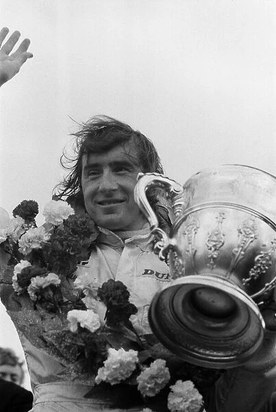 Jackie Stewart, World Champion racing driver, pictured after he won the British Grand