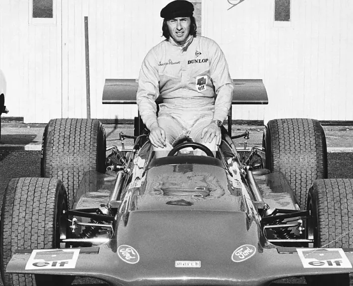 Framed Print : Jackie Stewart world champion racing driver sat on his March 701 F1 car in 1970
