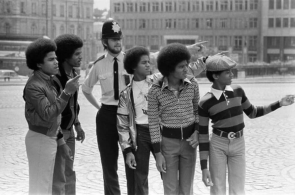 The Jackson 5 pop group pictured at Hyde Park Corner. They are Randy, 15, Michael, 18