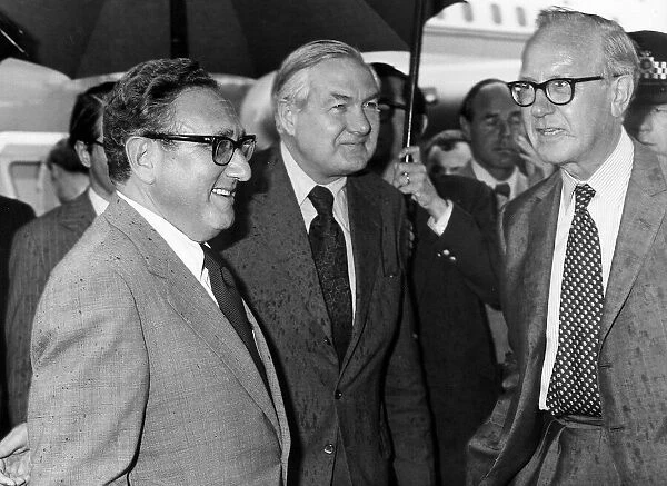 James Callaghan meets with Henry Kissinger at Heathrow Airport in the rain 1975