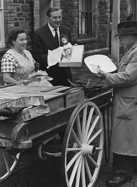 James Callaghan MP in Adamsdown in Cardiff talking to fishmonger and a housewife 1964