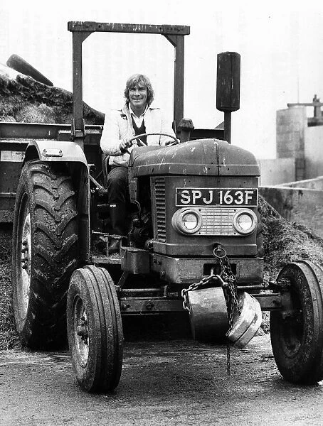 James Hunt former motor racing world champion driver driving a tractor January 1982