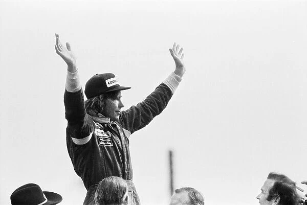 James Hunt on the podium celebrates winning The 1977 British Grand Prix Formula One