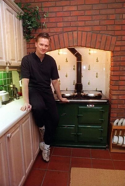 James MacPherson actor in Taggart In his kitchen with old wood stove aga March 1997