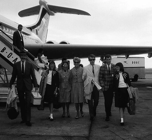 James Stewart arrives at London Airport with his wife Gloria