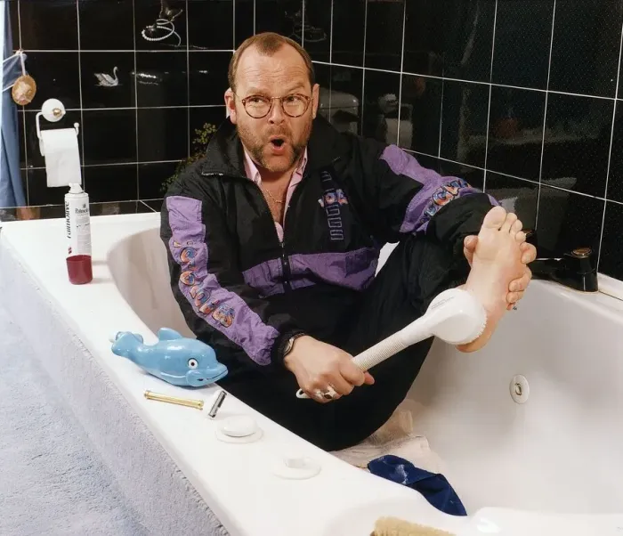 Framed Print : James Whale radio presenter sits in the bath wearing a tracksuit Framed Print : James Whale radio presenter sits in the bath wearing a tracksuit