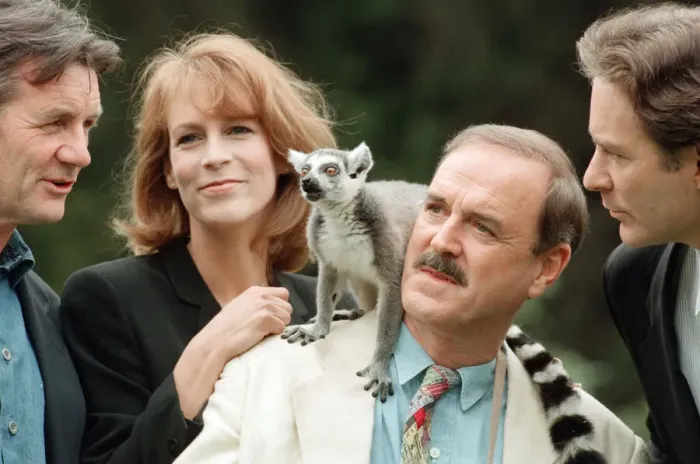 Framed Print : Jamie Lee Curtis, John Cleese (centre in the white jacket and jeans)