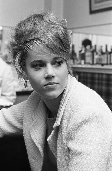 Jane Fonda, american actress, sitting at a bar in Paris, France, April 1964