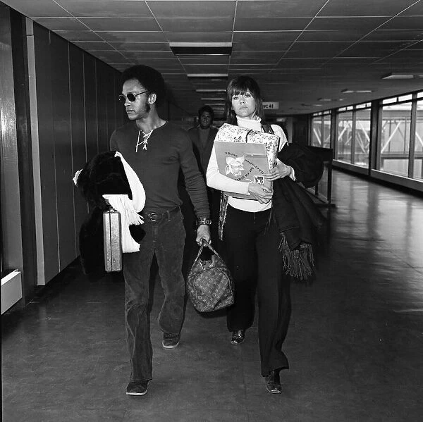 Jane Fonda arrives at Heathrow Airport with Michael Hunter