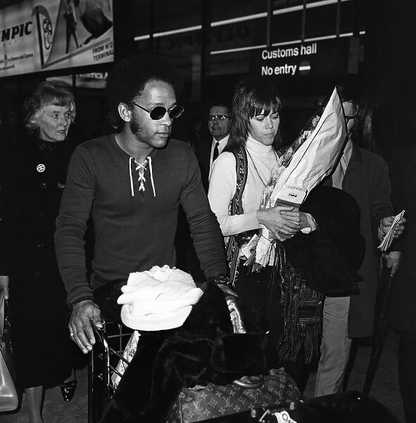 Jane Fonda arrives at Heathrow Airport with Michael Hunter