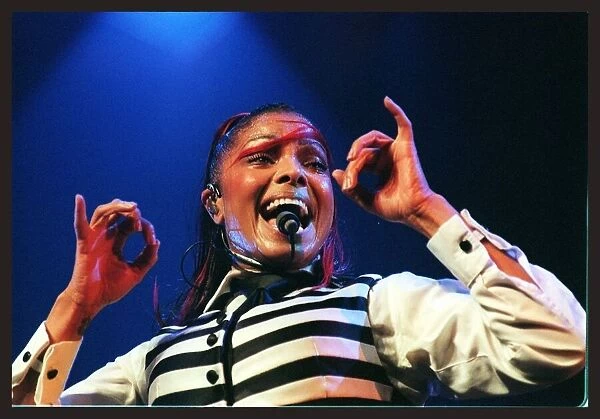 Janet Jackson in concert at the SECC June 1998 singing into microphone