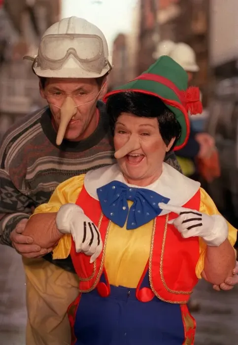 Framed Print : Janette Tough November 1998 as Jimmy Krankie wearing Pinocchio with construction builder