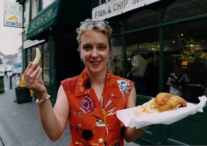 Framed Print : Janice Forsyth TV presenter in Rothesay fish chips supper orange shirt