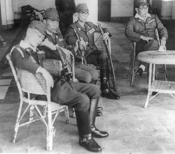 Japanese officers in Saigon, French Indo China, wait for the arrival of Major Douglas