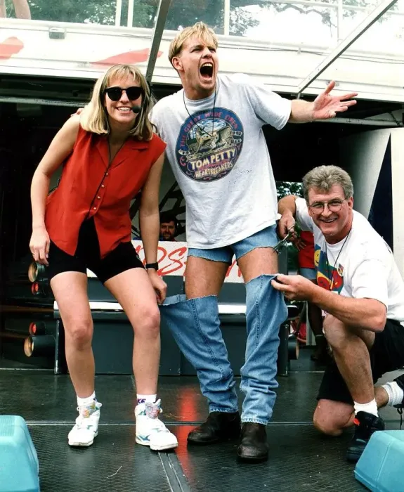 Framed Print : Jason Donovan Balloch Park Radio 1 roadshow having his jeans cut off by Smiley Framed Print : Jason Donovan Balloch Park Radio 1 roadshow having his jeans cut off by Smiley