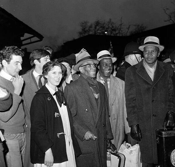 Jazz legend George Lewis arrives at Euston station, London