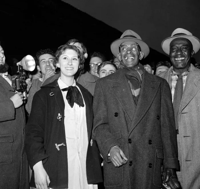Framed Print : Jazz legend George Lewis arrives at Euston station, London