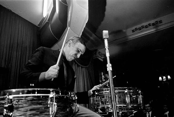 Jazz performer Buddy Rich, Drummer on kit. 1960s