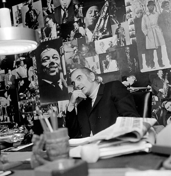 Jazz performer and legendary club owner Ronnie Scott in his office in London