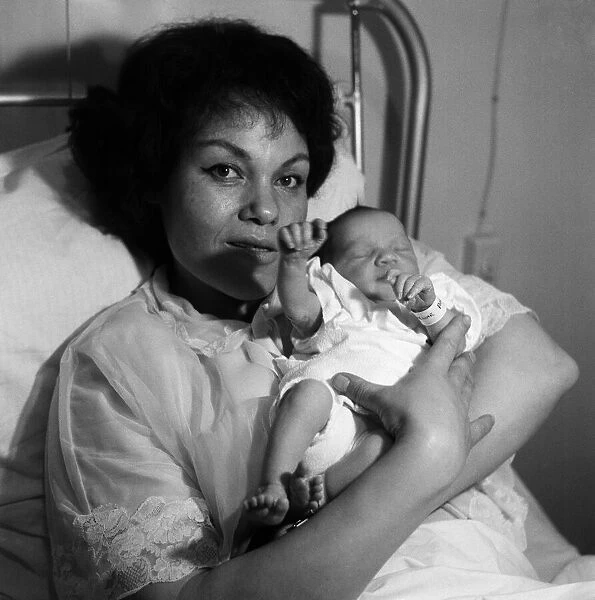 Jazz singer Cleo Laine pictured with her new baby daughter Jaqueline. 6th February 1963