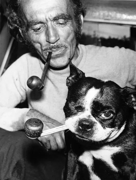 Framed Print : Jean Morel and his dog Butch a Boston Bull Terrier 1971 smoke their pipes at home