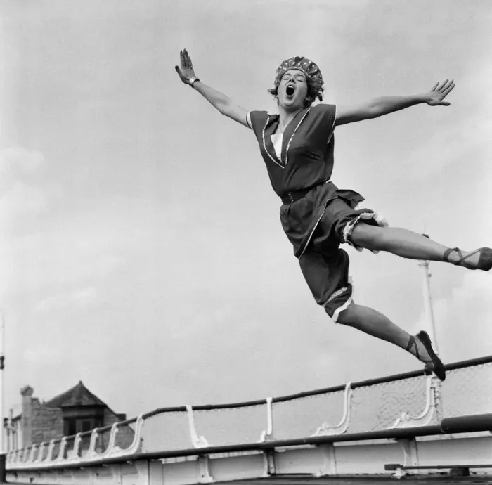 Framed Print : Jean Richardson, aged 23 from Bath, wears a 1890 bathing costume as she leaps high in Framed Print : Jean Richardson, aged 23 from Bath, wears a 1890 bathing costume as she leaps high in