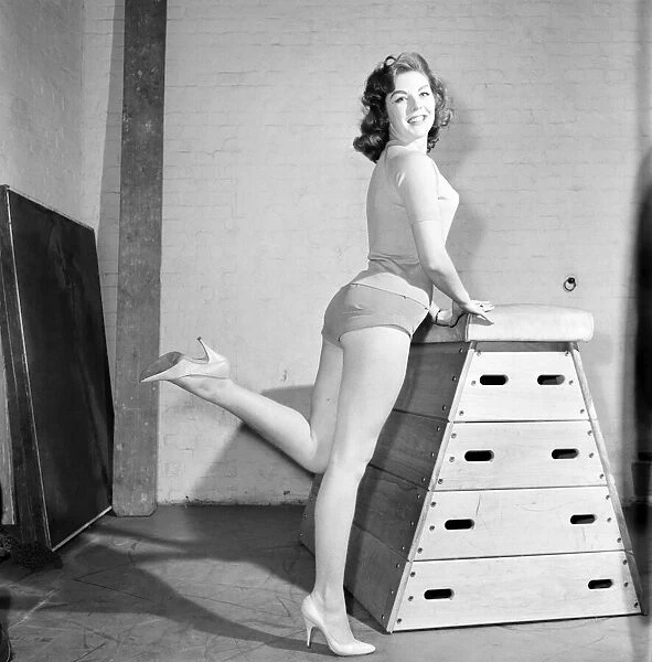 Jean Ryder seen here exercising on a wooden horse. 1959