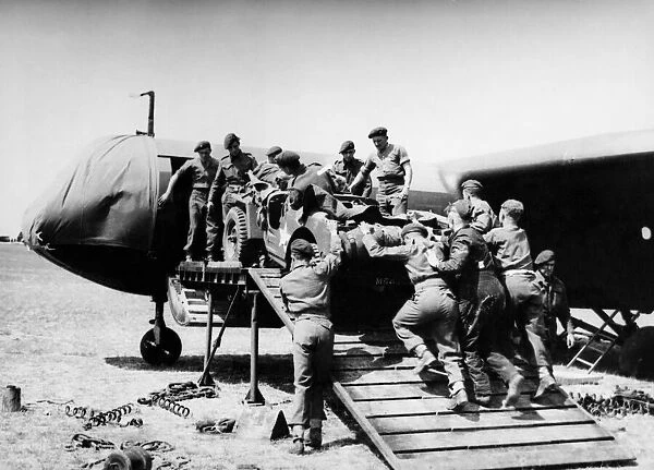 A jeep is loaded aboard a Airspeed Horsa glider during preparations for Operation