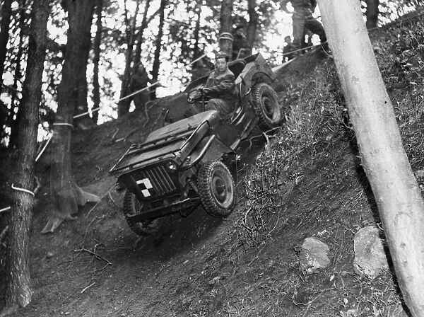 A jeep being lowered down a hillside. North East England