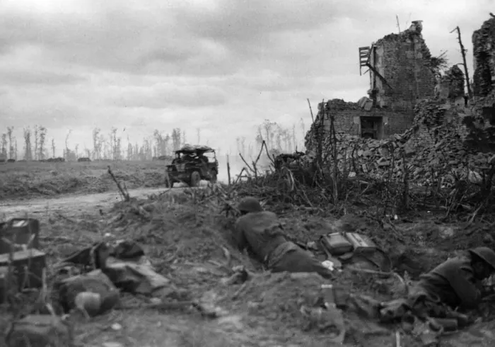 Framed Print : A jeep passes British and Canadian troops after the capture of Caen. 9th July 1944 Framed Print : A jeep passes British and Canadian troops after the capture of Caen. 9th July 1944