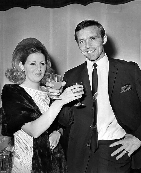 Jeff Astle and wife toasting each other at a reception after West Bromwich Albion