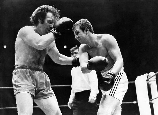Jeff Burns (left), the Swansea light-middleweight, on his way to defeat by Londoner Jimmy