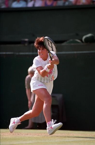 JENNIFER CAPRIATI PLAYING ON COURT AT THE 1993 WIMBLEDON TENNIS TOURNAMENT -