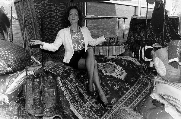 Jenny Seagrove Actress sitting on a rug carpet