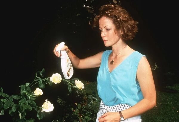 Jenny Seagrove the actress spraying her roses