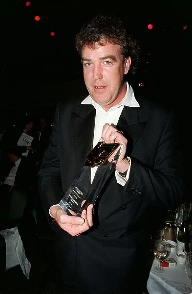 Jeremy Clarkson TV Presenter March 98 Holding award for best tv car show